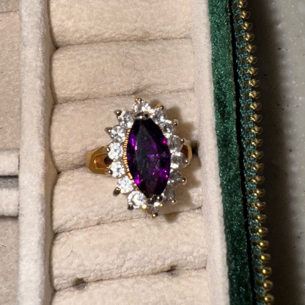 Elegant Gold Ring with Purple Gemstone and Clear Accents